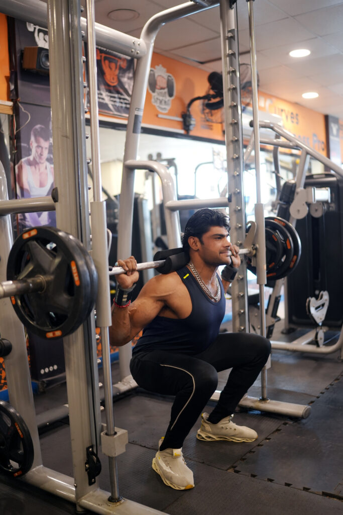 Man doing squats on Smith machine at Curve Fitness Pro, showcasing strength and perfect form.